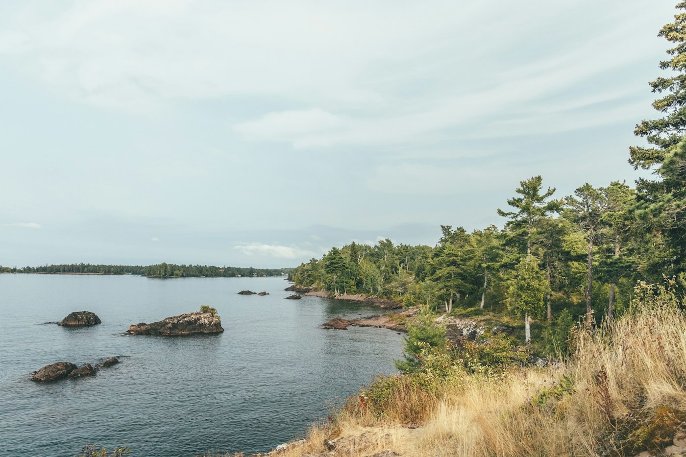 A rocky, pine-lined point on the Lake Superior coastline